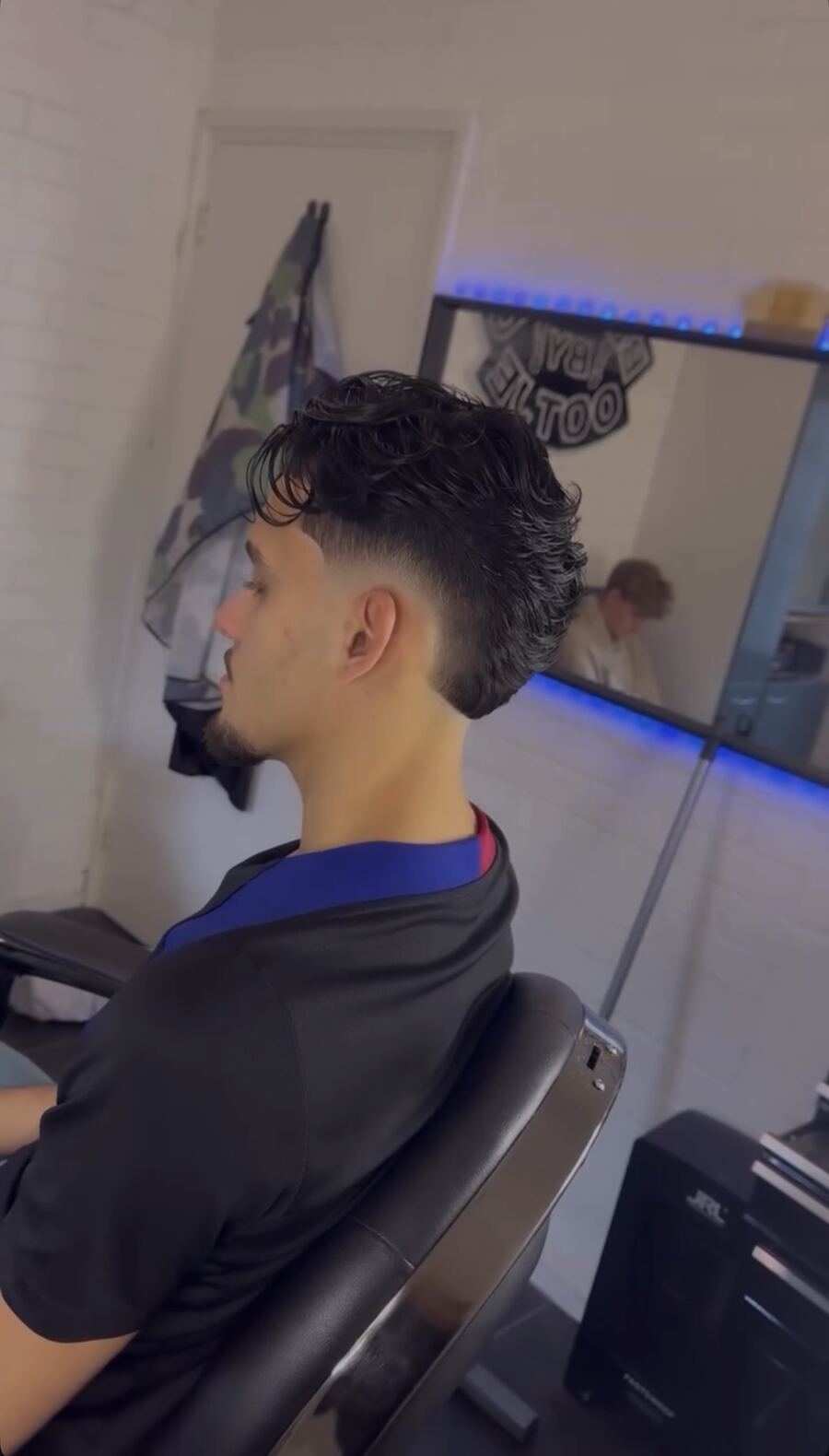 Golvende quiff met fade